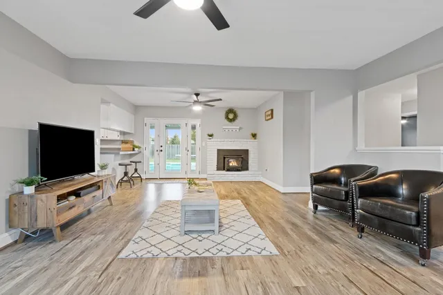 a living room with furniture and a flat screen tv