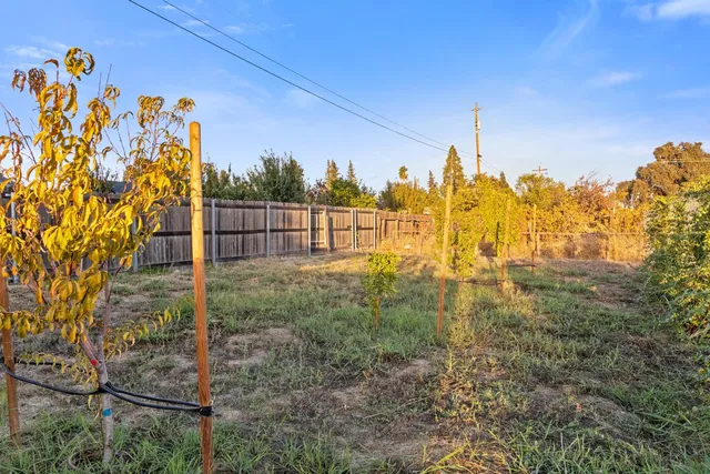 a view of a pathway with a backyard