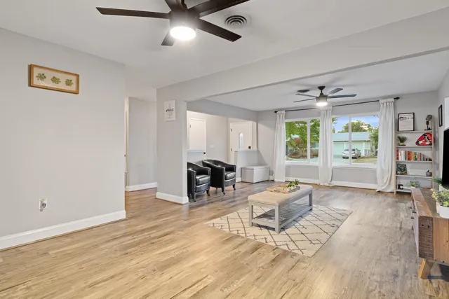 a living room with furniture and window