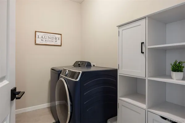a view of storage and utility room with washer and dryer