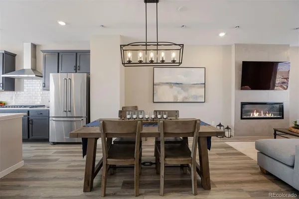 a view of a dining room with furniture wooden floor and chandelier
