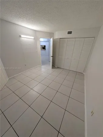 a view of a livingroom and entryway