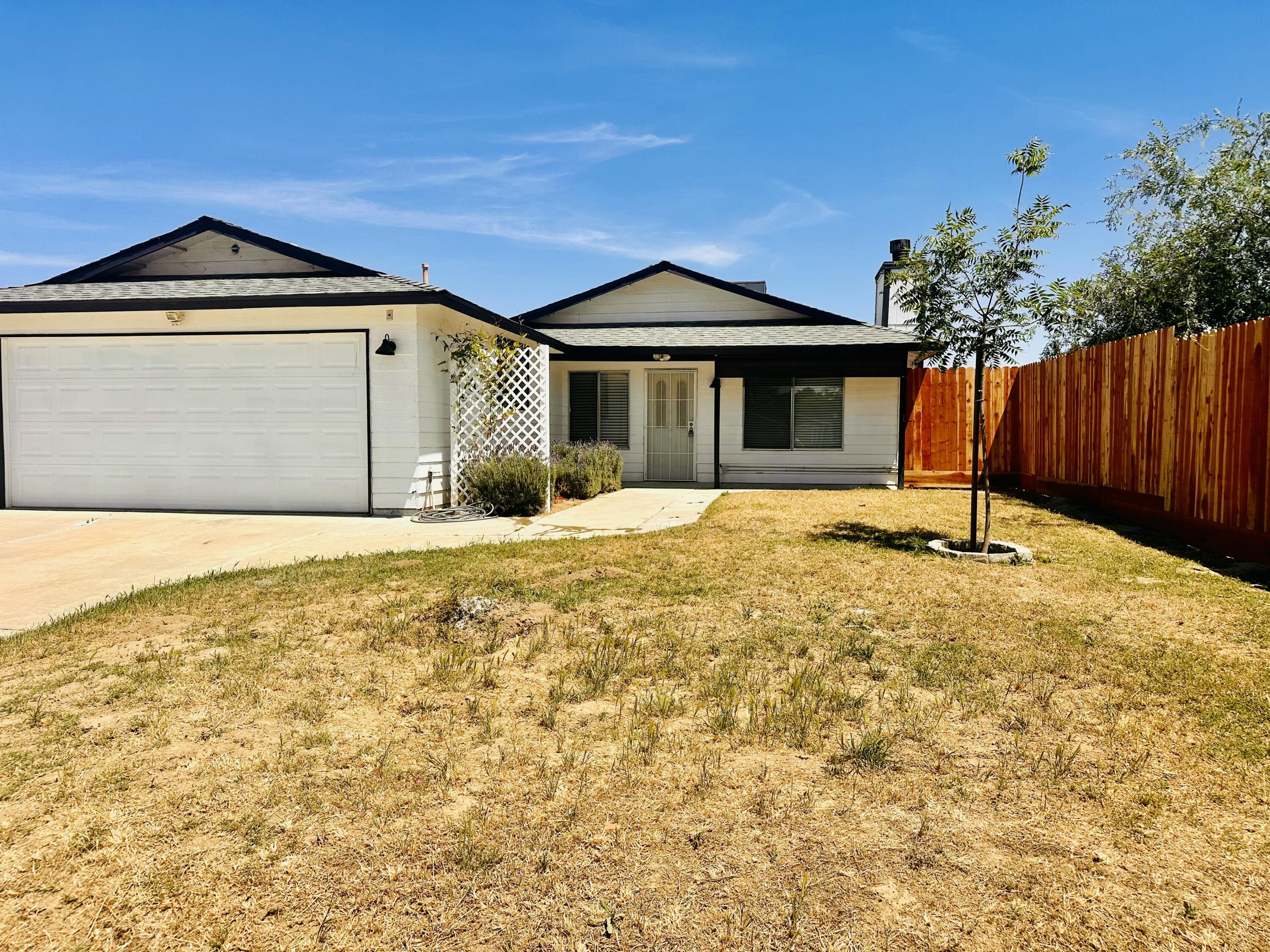 30880 Farr Road Visalia, CA 93291 - Photo 1 of 27 a front view of a house with a yard
