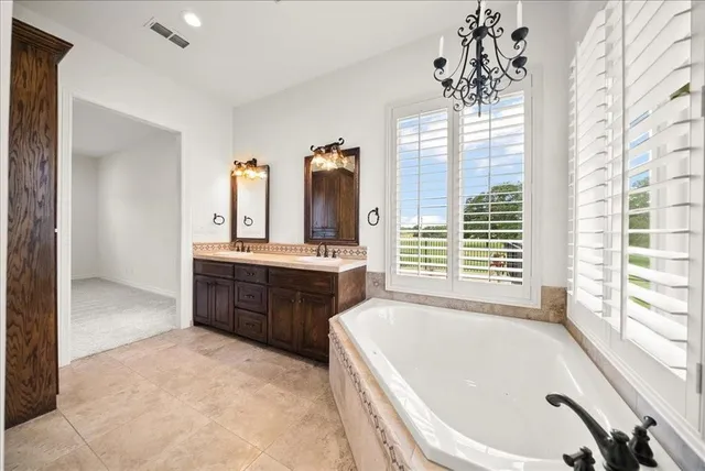a view of bathroom with bathtub and shower