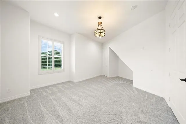 a bathroom with a sink a toilet a mirror and shower