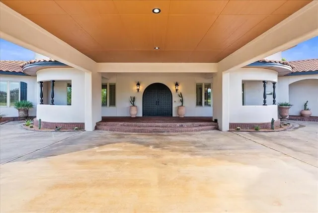 a view of a livingroom with a patio and a yard