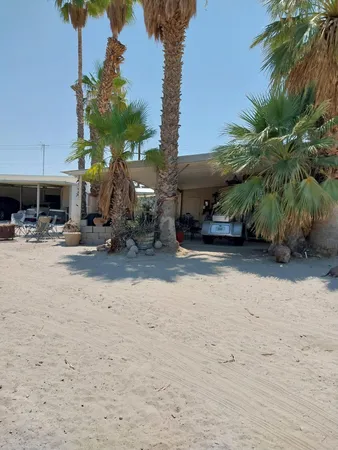 a view of a car park in front of a house