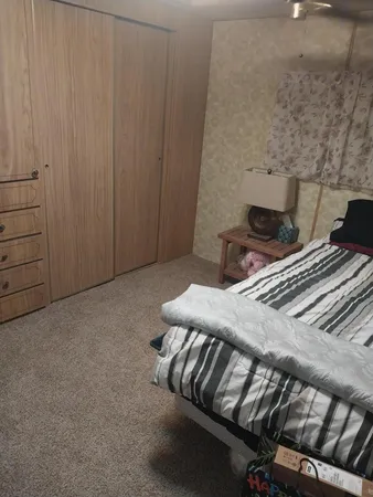 a living room with furniture and a chair