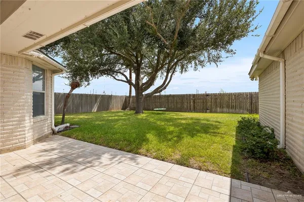 a view of backyard with green space