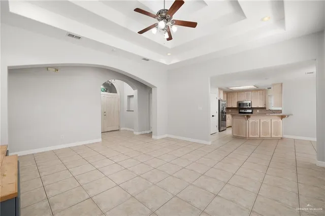 a view of a kitchen with a sink and cabinets