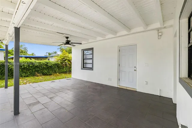 a view of a room with window and a swimming pool