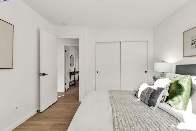 a bedroom with a bed and a table