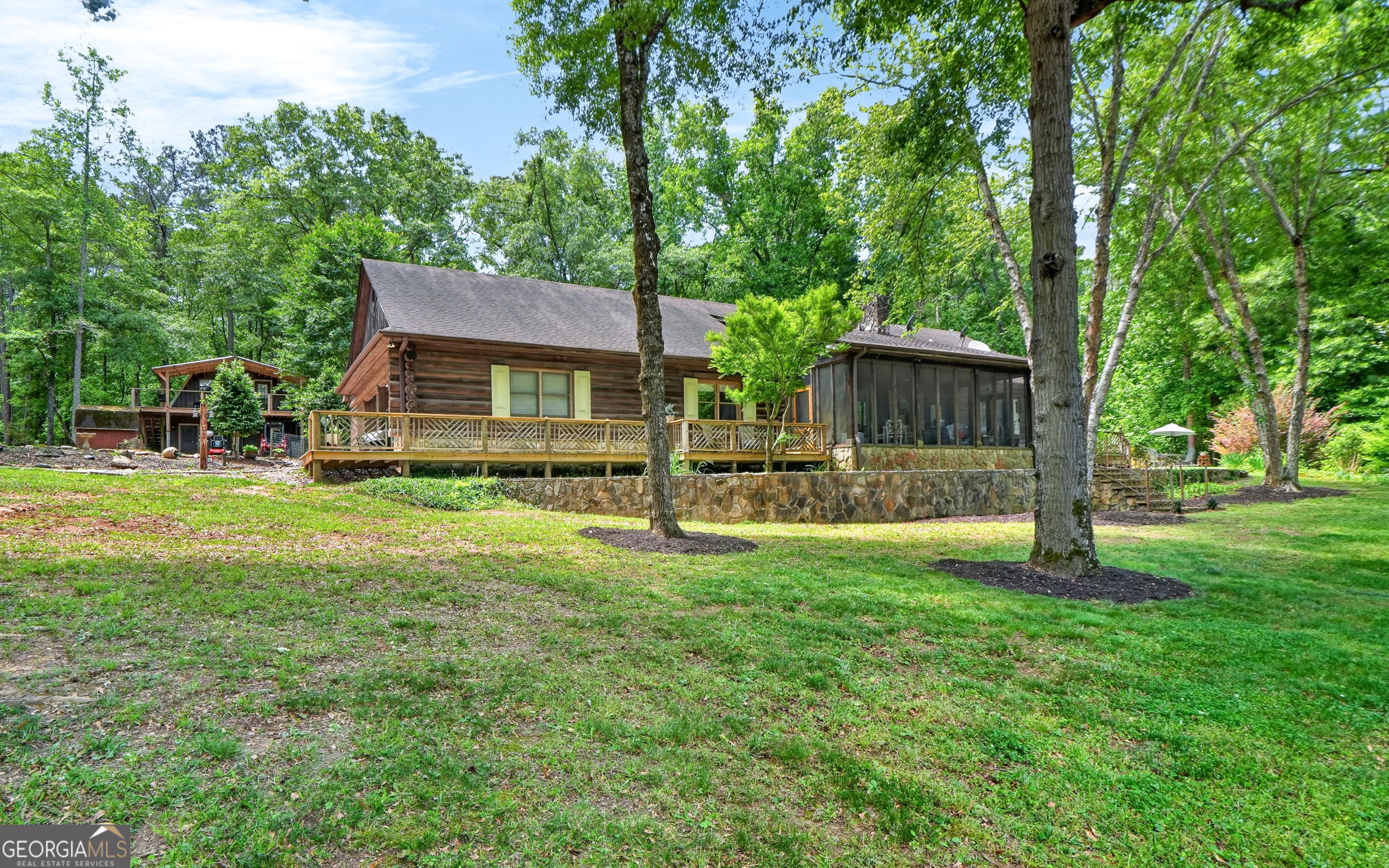 261 McIntosh Circle Jackson, GA 30233 - Photo 63 of 77 a view of a house with backyard and a tree
