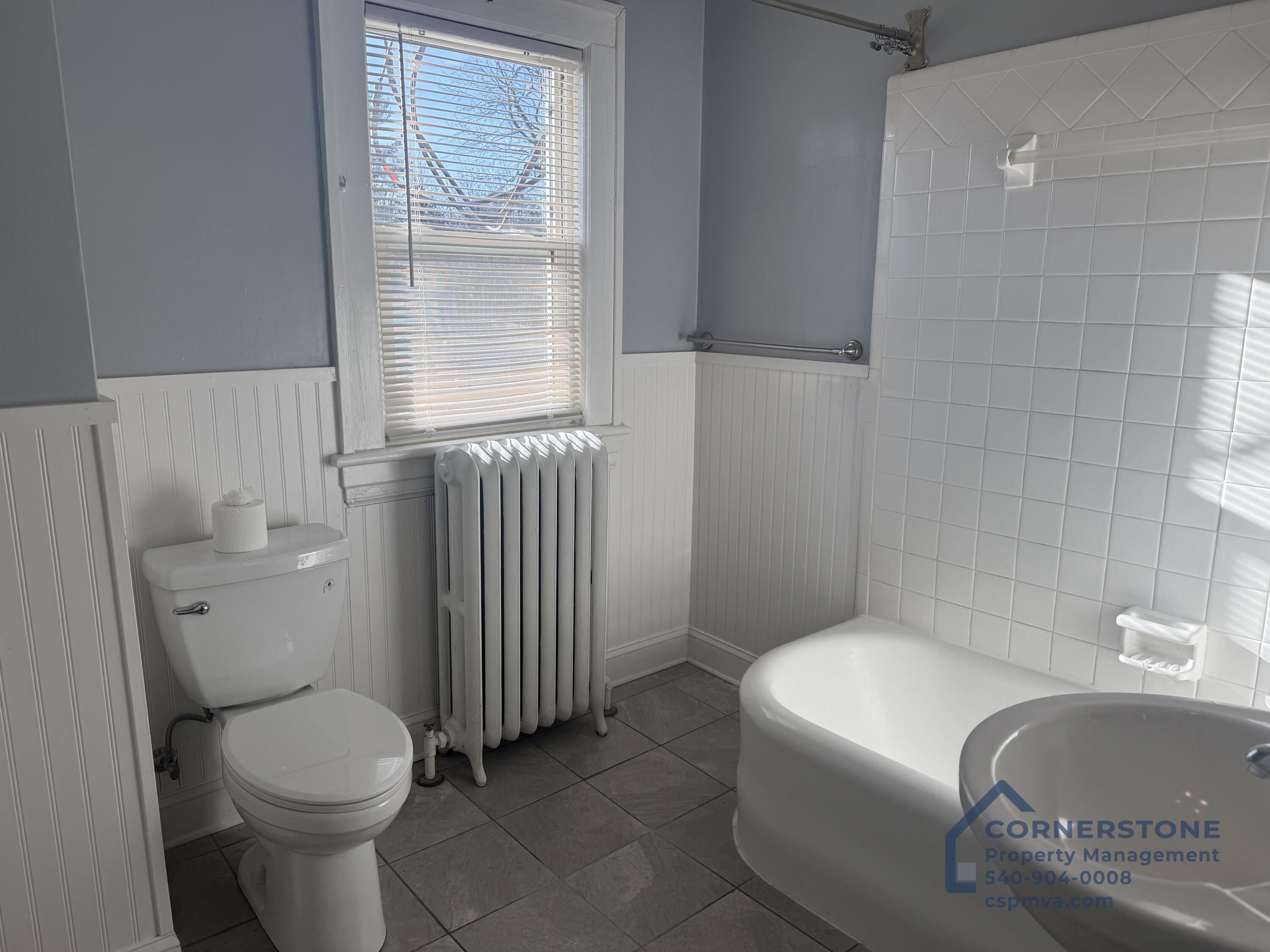 2423 Lofton Road Southwest, Unit 2 Roanoke, VA 24015 - Photo 4 of 14 a bathroom with a sink toilet and window