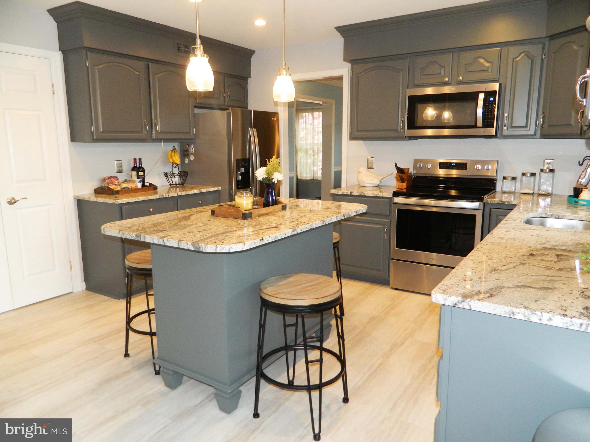 308 Styer Road Glenmoore, PA 19343 - Photo 8 of 22 Kitchen with tile floor & granite countertop
