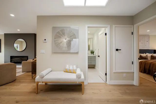 a kitchen with stainless steel appliances granite countertop a refrigerator a stove a sink dishwasher and a refrigerator with wooden floor