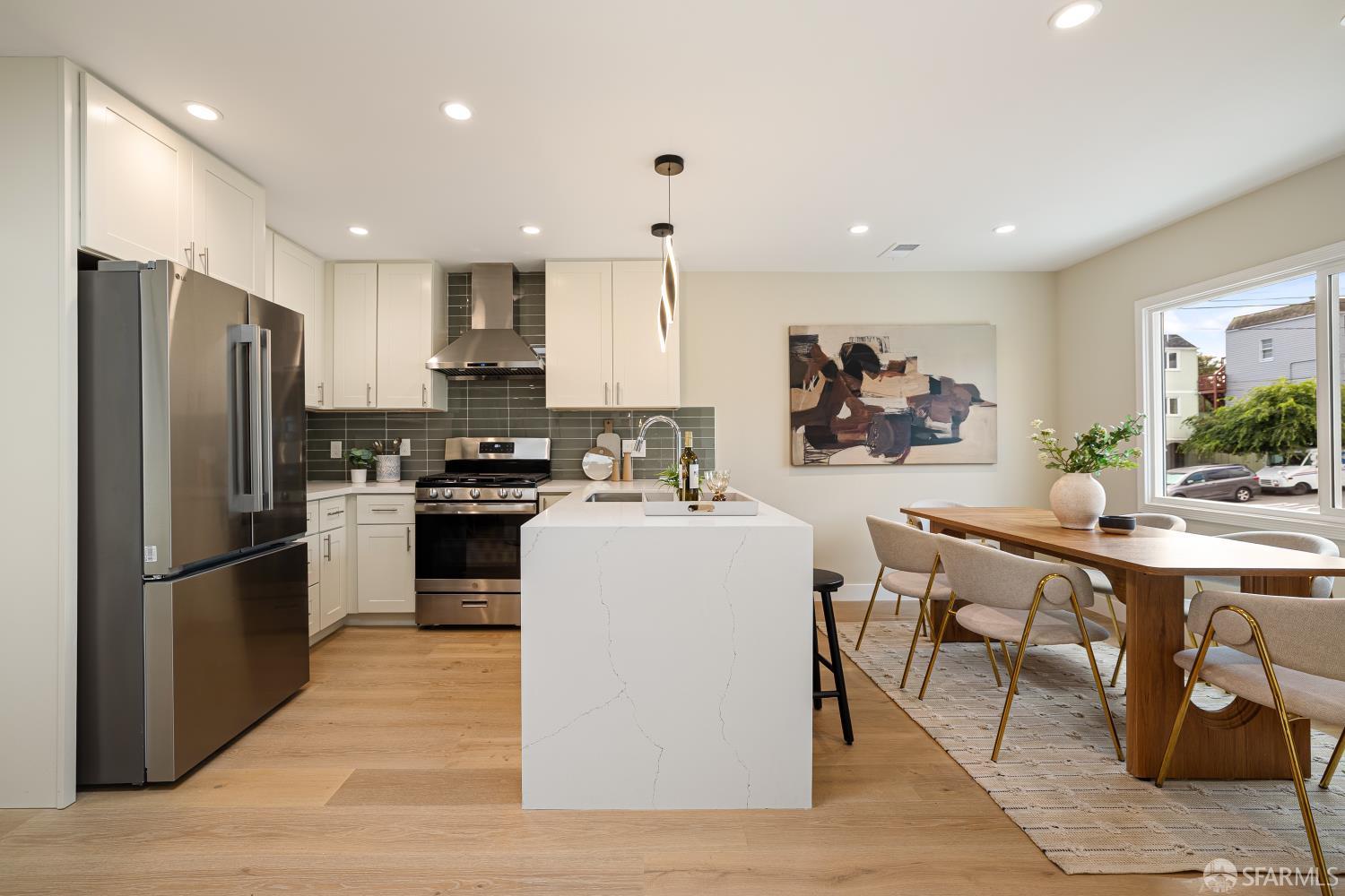 537 Russia Avenue San Francisco, CA 94112 - Photo 13 of 69 a kitchen with stainless steel appliances granite countertop a refrigerator a stove a sink dishwasher and a refrigerator with wooden floor