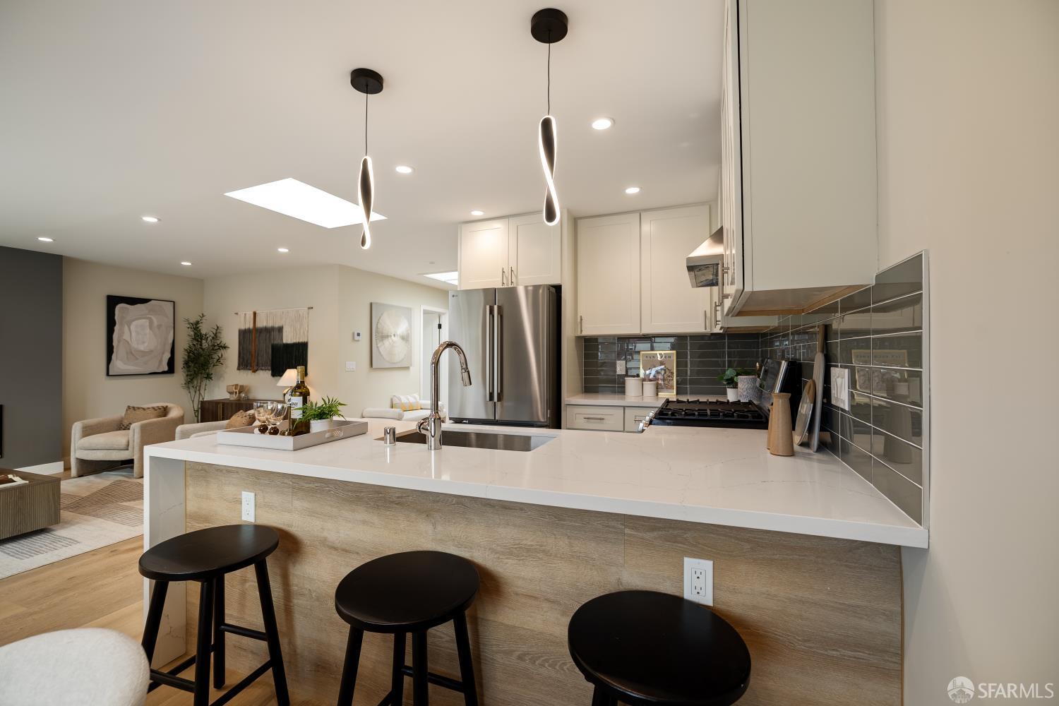537 Russia Avenue San Francisco, CA 94112 - Photo 21 of 69 a kitchen with stainless steel appliances granite countertop a sink a stove and a refrigerator