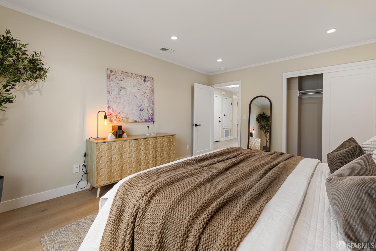 537 Russia Avenue San Francisco, CA 94112 - Photo 27 of 69 a bedroom with a bed and a painting on the wall