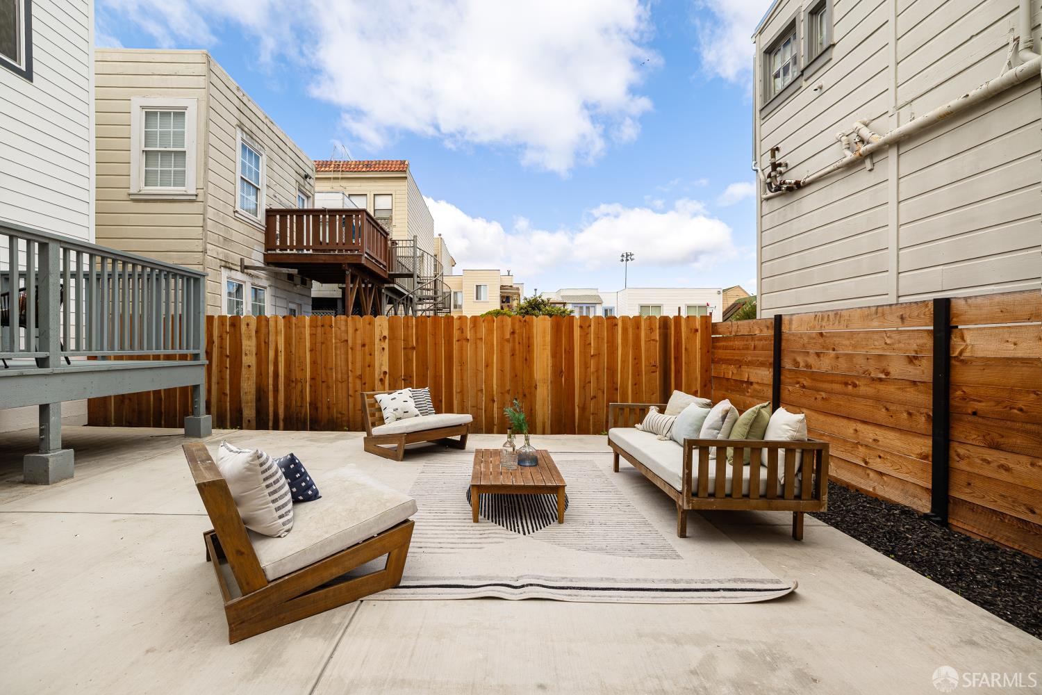 537 Russia Avenue San Francisco, CA 94112 - Photo 52 of 69 a view of a patio with couches and a table and chairs