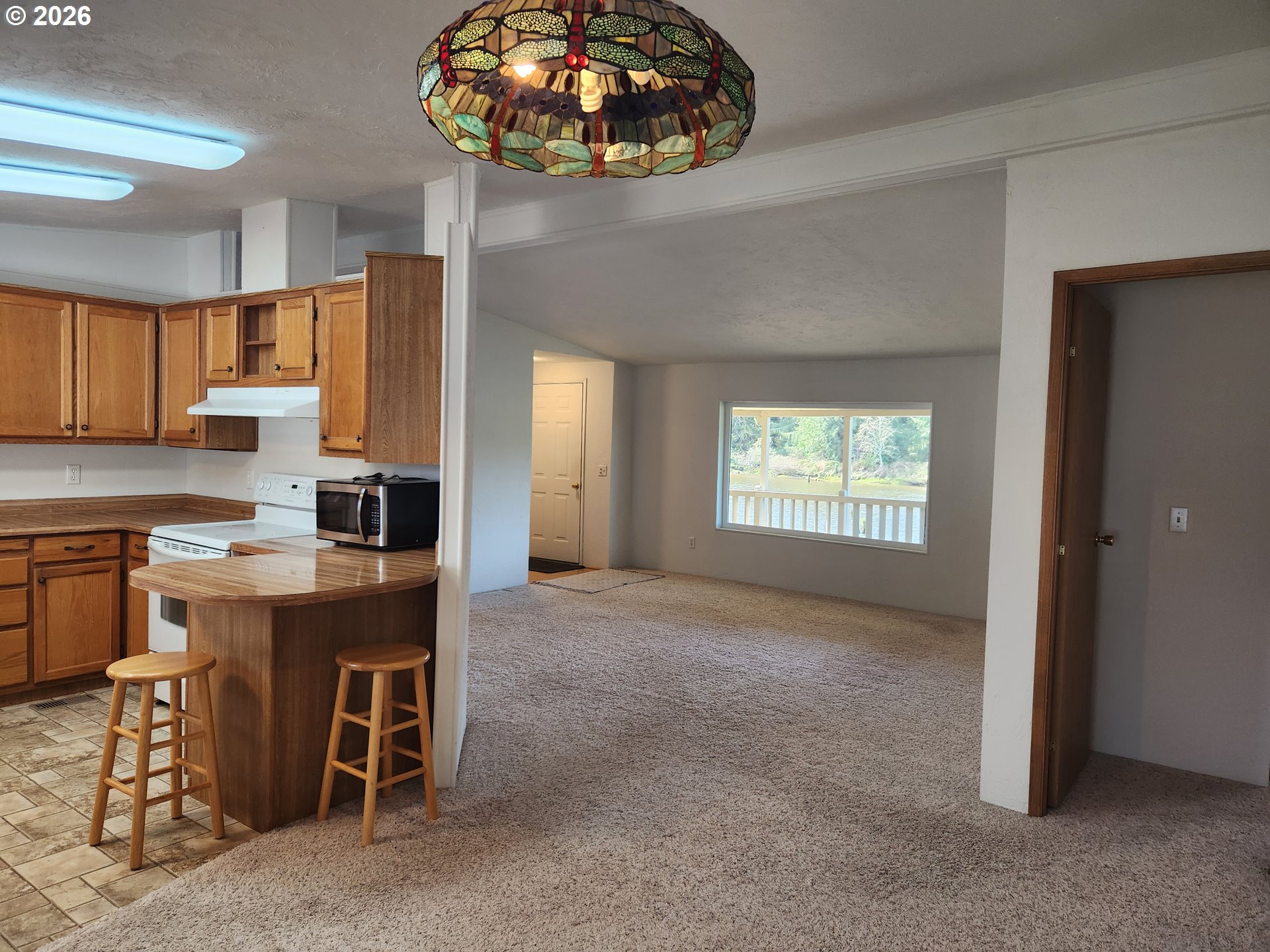 100 River Bend Road, Unit 24 Reedsport, OR 97467 - Photo 13 of 36 a view of a kitchen and dining room