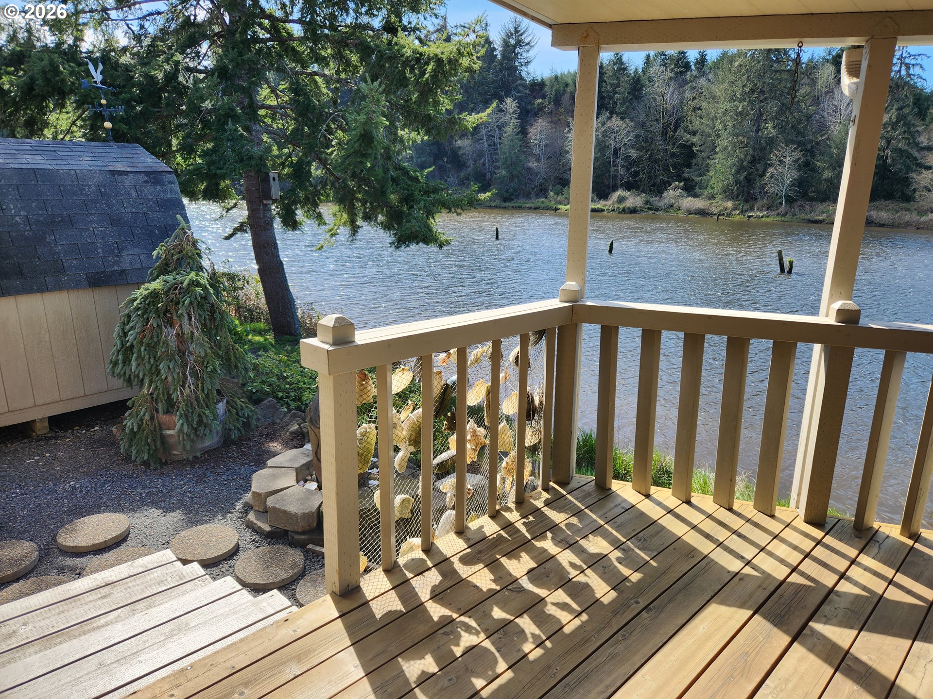 100 River Bend Road, Unit 24 Reedsport, OR 97467 - Photo 34 of 36 a view of a two chairs in the deck
