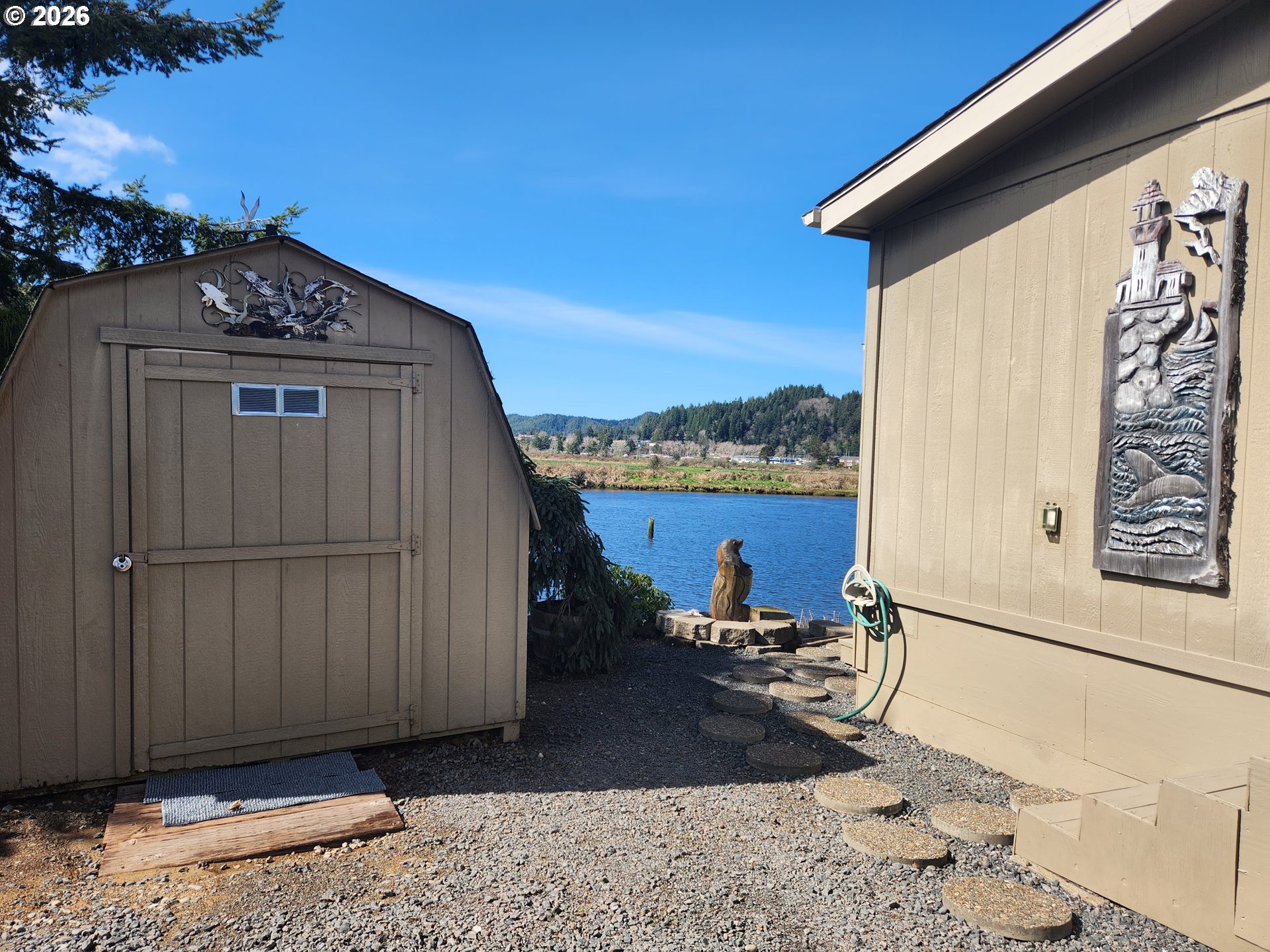 100 River Bend Road, Unit 24 Reedsport, OR 97467 - Photo 4 of 36 a view of a terrace with a wooden fence