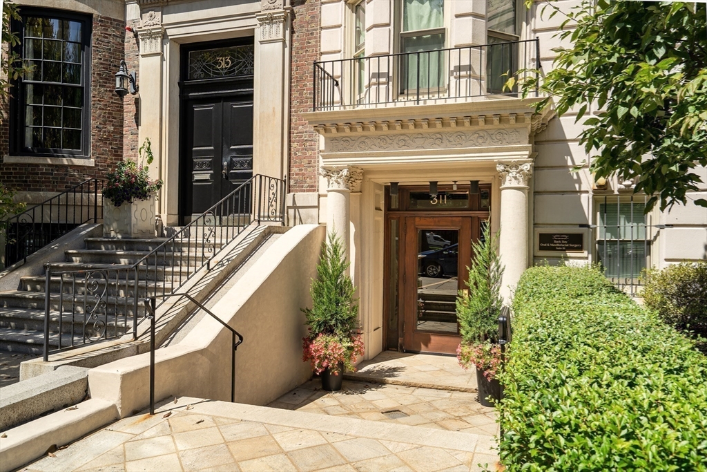 311 Commonwealth Avenue, Unit 71 Boston, MA 02115 - Photo 16 of 19 a front view of a house with a yard
