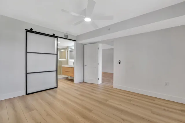 a view of an empty room with a window