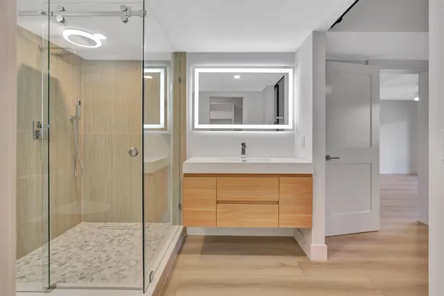 a bathroom with a sink and a mirror
