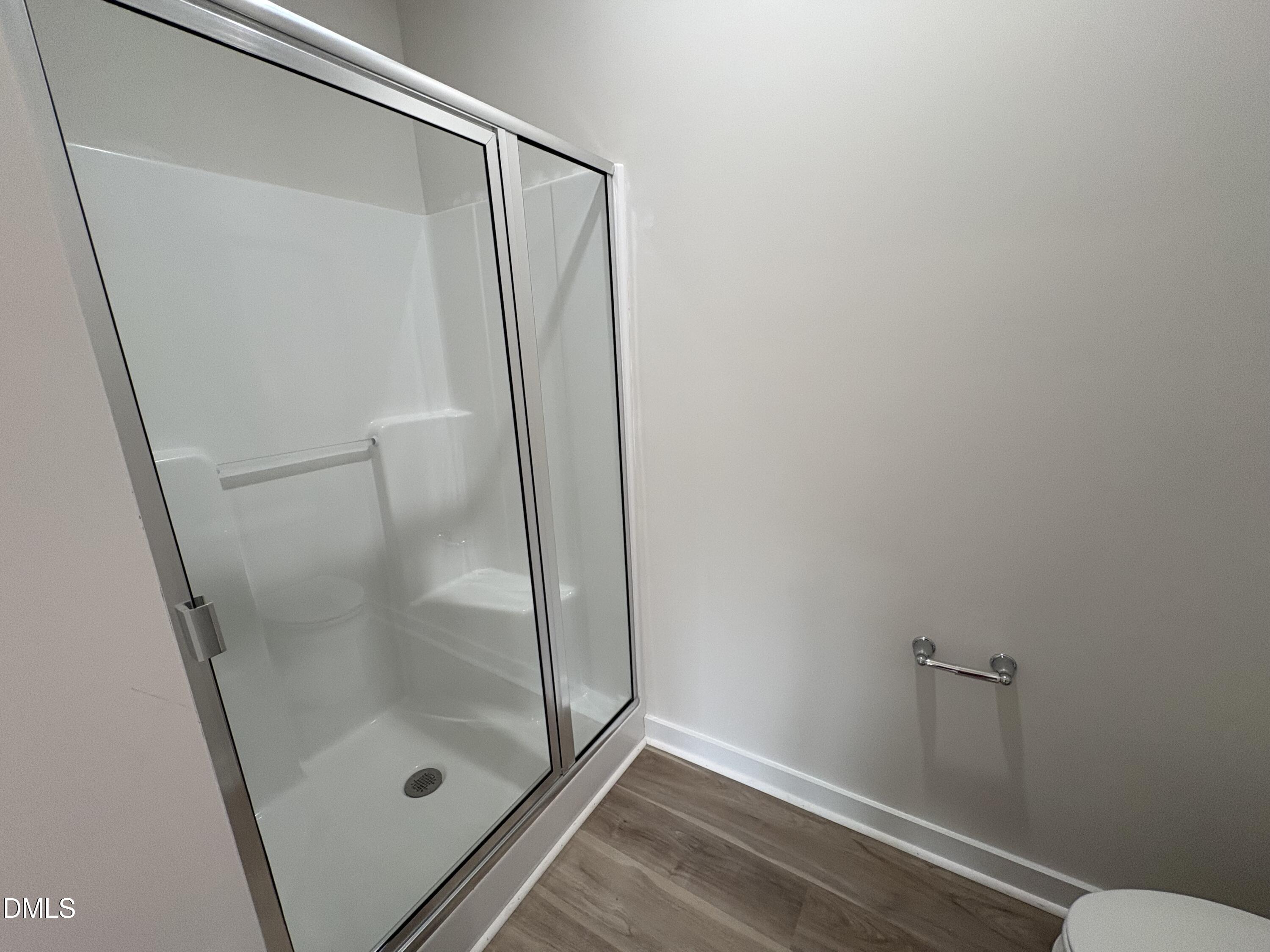 253 Jacobs Ridge Drive Four Oaks, NC 27524 - Photo 12 of 17 a bathroom with a glass door shower