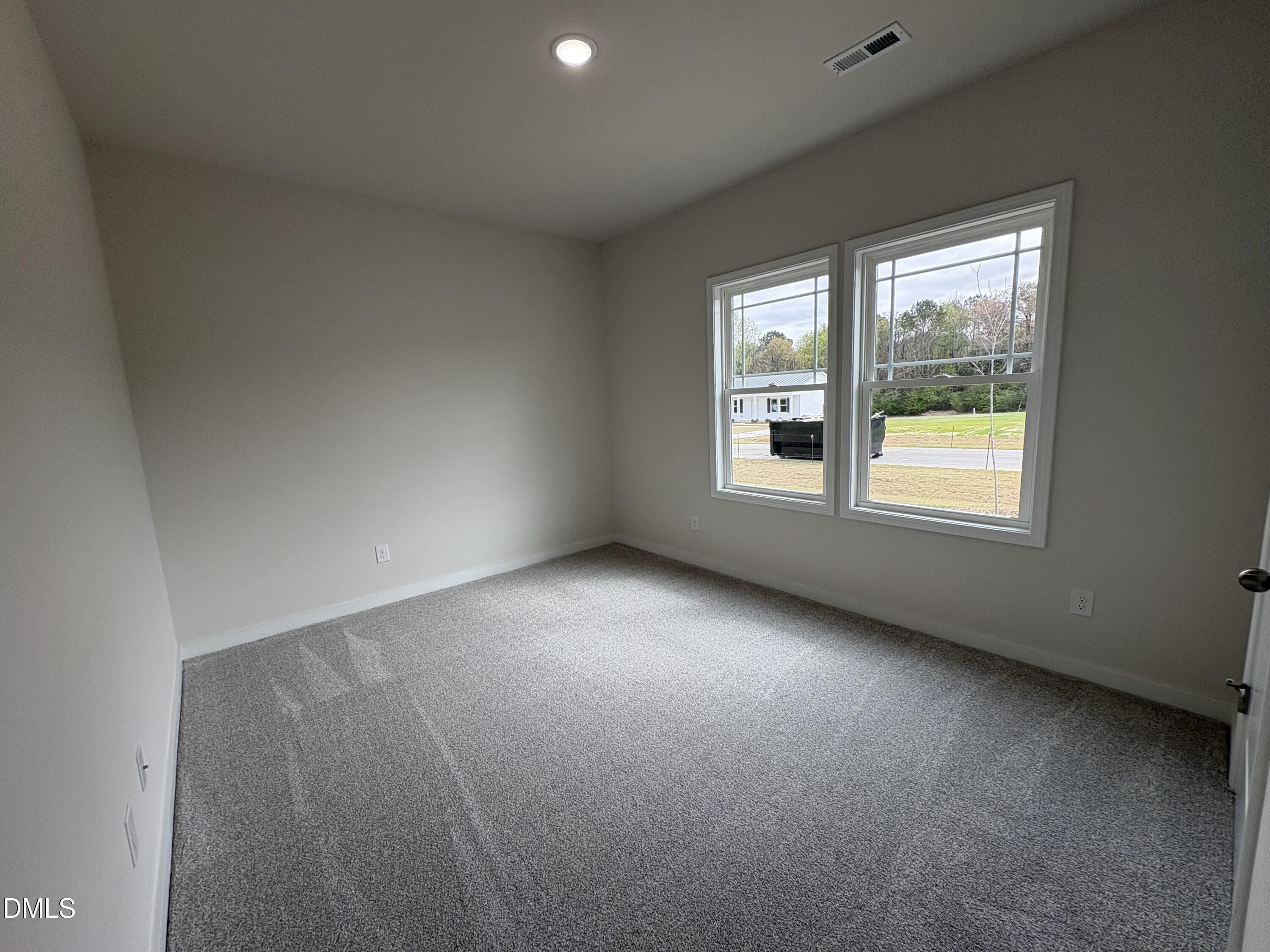 253 Jacobs Ridge Drive Four Oaks, NC 27524 - Photo 13 of 17 an empty room with a window