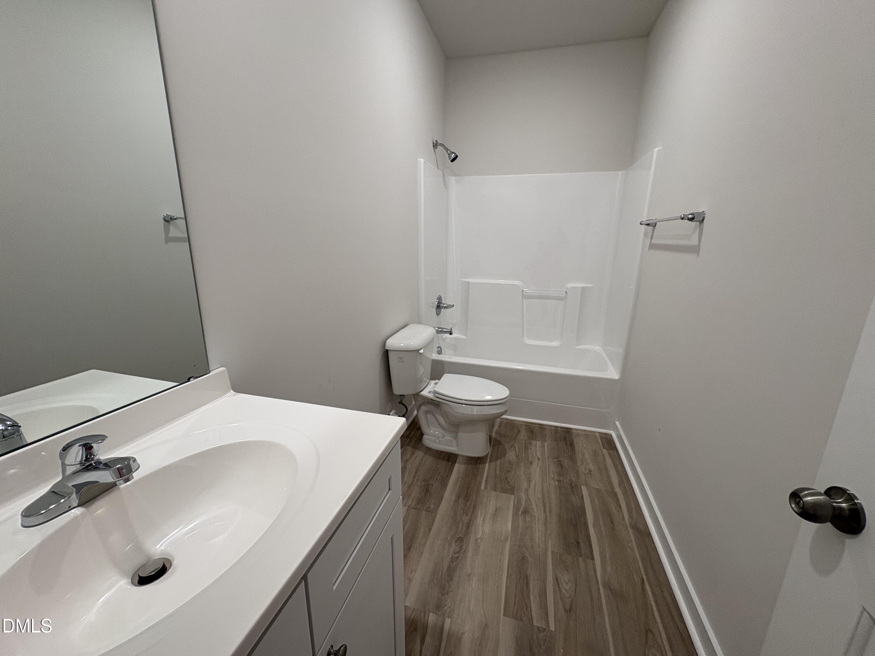 253 Jacobs Ridge Drive Four Oaks, NC 27524 - Photo 15 of 17 a bathroom with a sink and a toilet