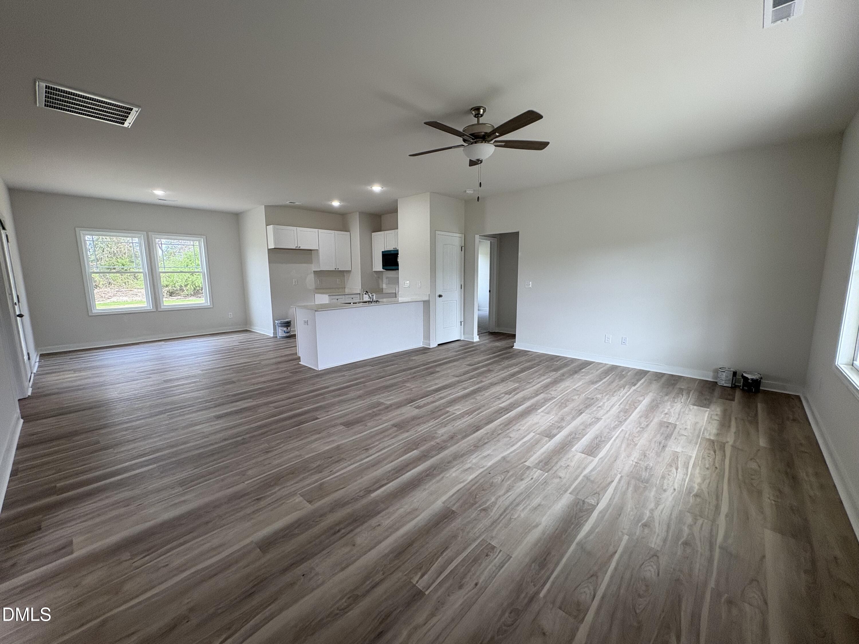 253 Jacobs Ridge Drive Four Oaks, NC 27524 - Photo 3 of 17 a view of empty room with wooden floor and window