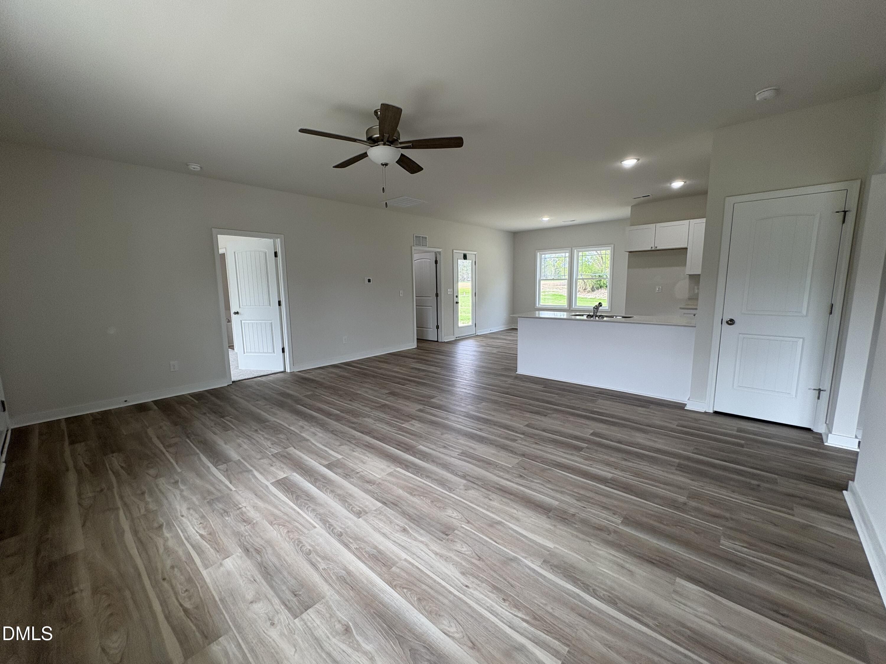 253 Jacobs Ridge Drive Four Oaks, NC 27524 - Photo 4 of 17 a view of empty room with wooden floor and window