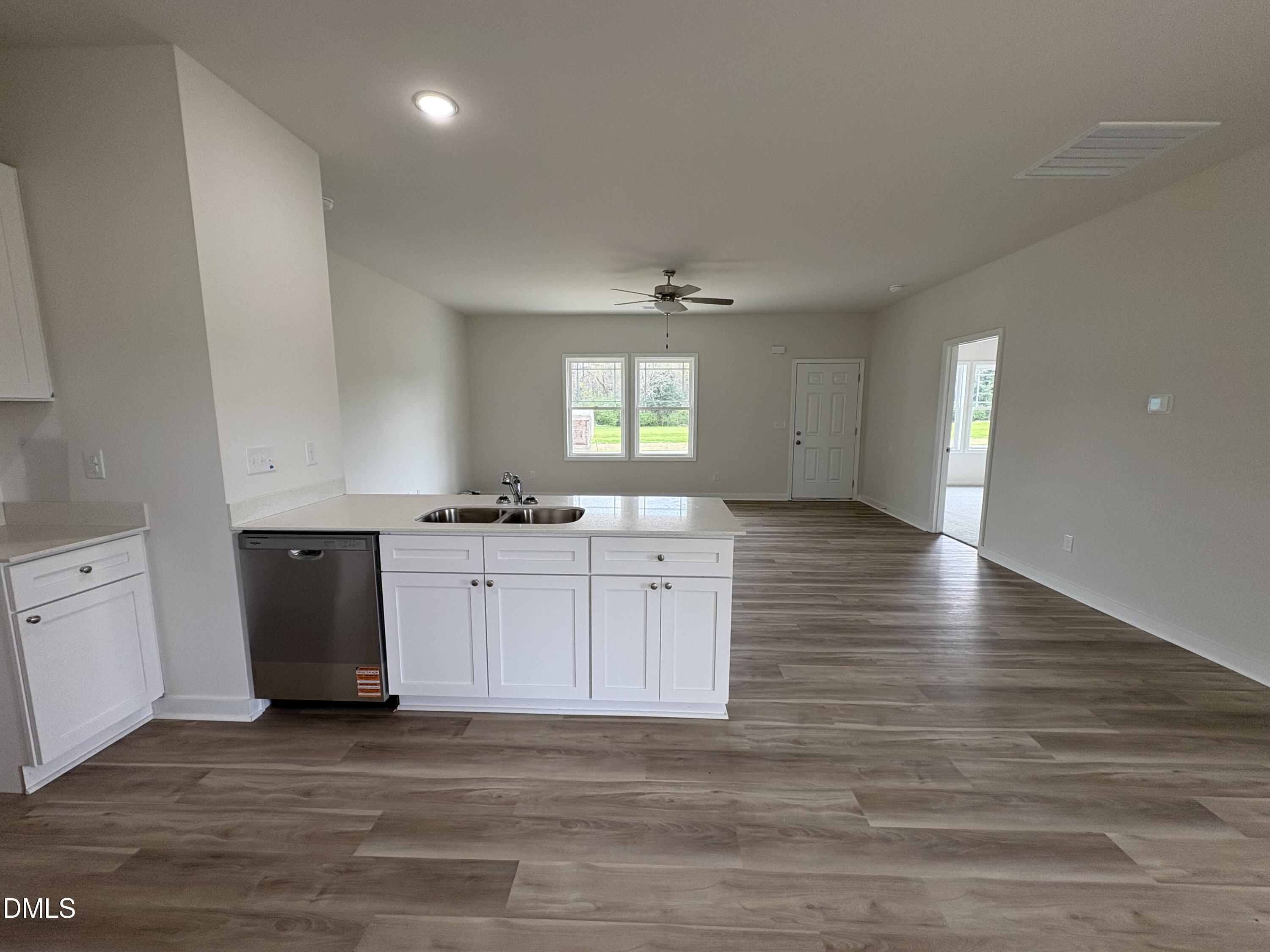 253 Jacobs Ridge Drive Four Oaks, NC 27524 - Photo 6 of 17 a view of a kitchen with a sink and dishwasher wooden floor