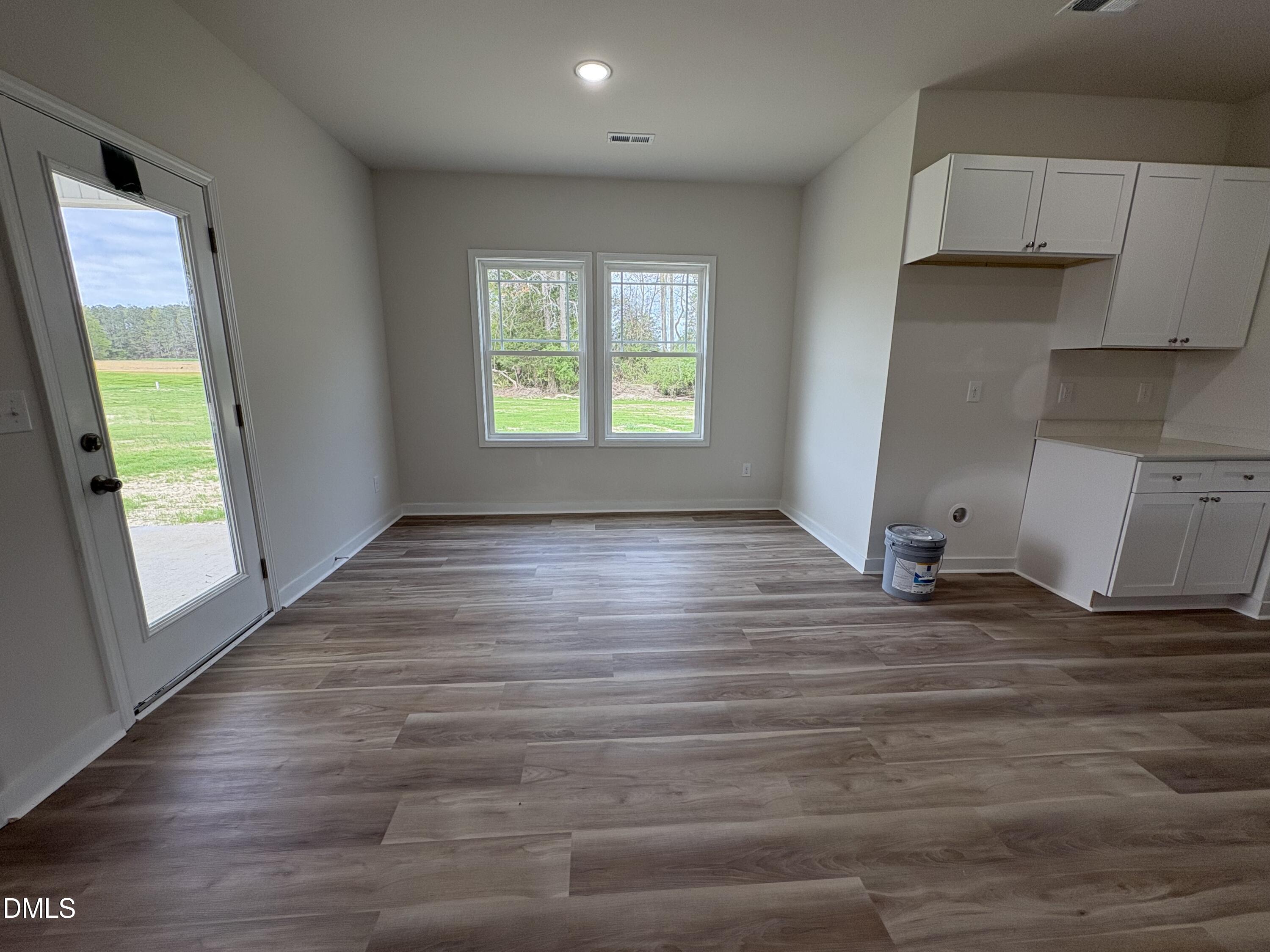 253 Jacobs Ridge Drive Four Oaks, NC 27524 - Photo 7 of 17 a view of empty room with window and wooden floor