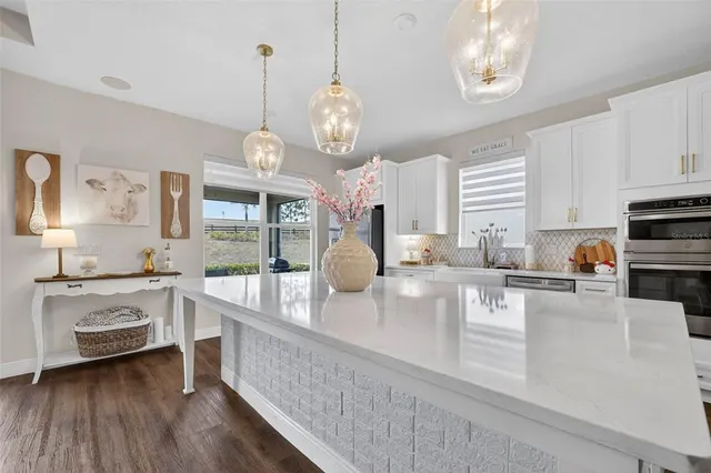 a spacious bathroom with a tub sink and mirror