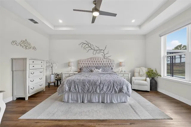 a bedroom with a bed and a dresser