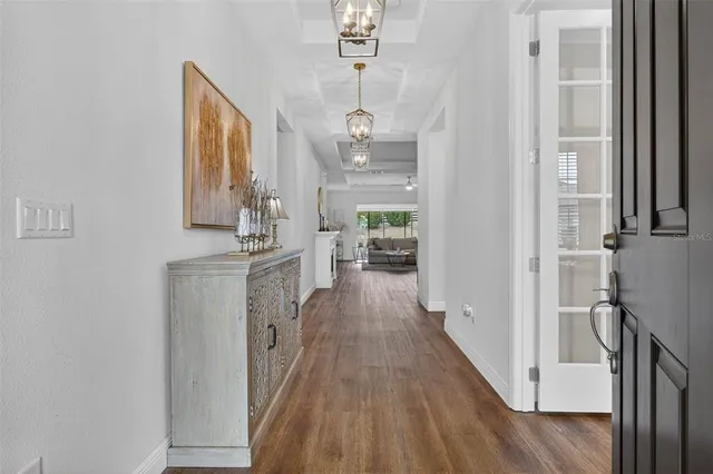 a dining room with furniture and wooden floor
