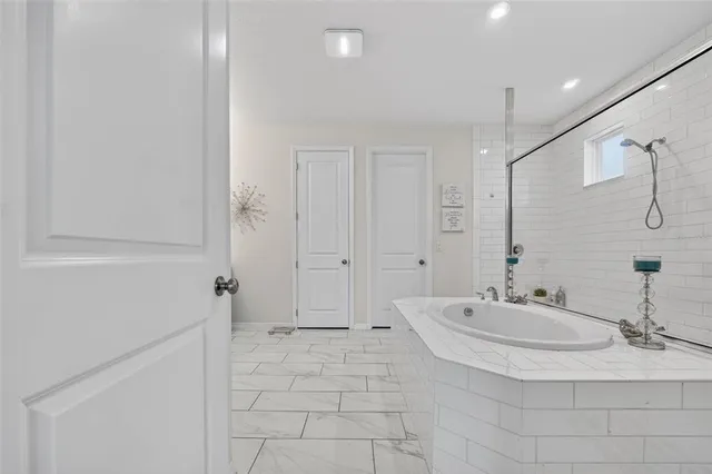 a utility room with multiple dryer and washer