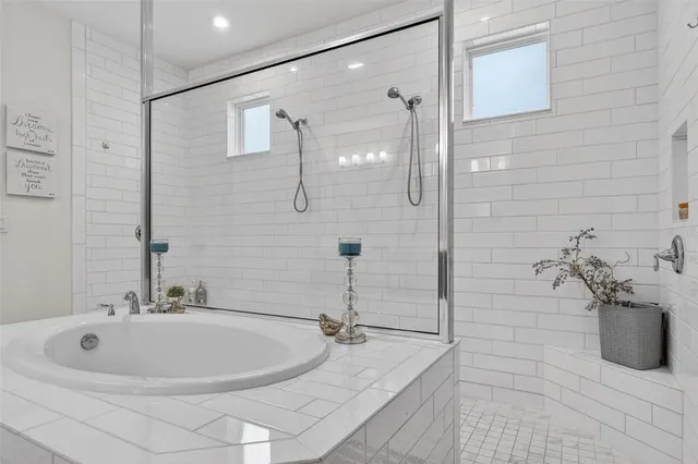 a bathroom with a sink a mirror and shower