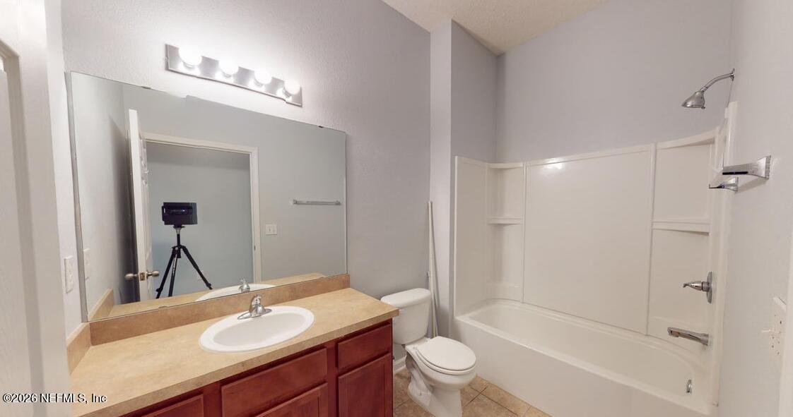 224 Larkin Place, Unit 103 St. Johns, FL 32259 - Photo 15 of 20 a bathroom with a sink a toilet and shower