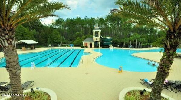 224 Larkin Place, Unit 103 St. Johns, FL 32259 - Photo 18 of 20 a view of a swimming pool with a patio