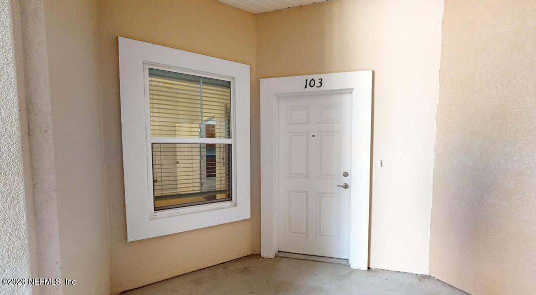 224 Larkin Place, Unit 103 St. Johns, FL 32259 - Photo 3 of 20 a view of an empty room with a window