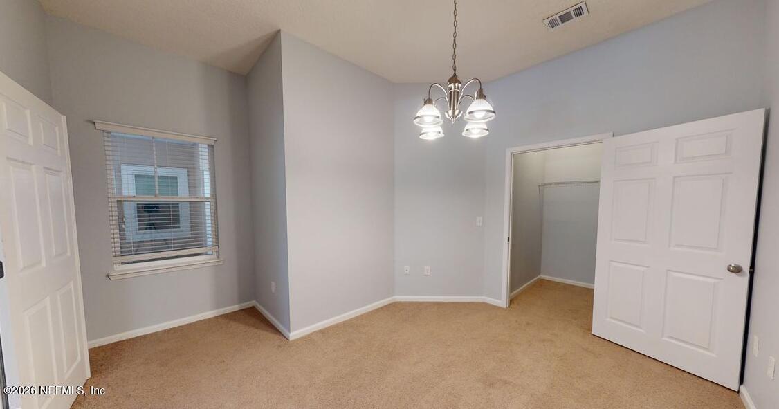 224 Larkin Place, Unit 103 St. Johns, FL 32259 - Photo 9 of 20 a view of livingroom with window