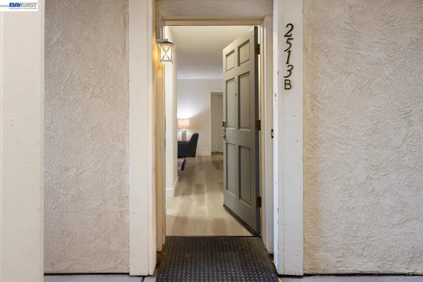 a view of a hallway with a room