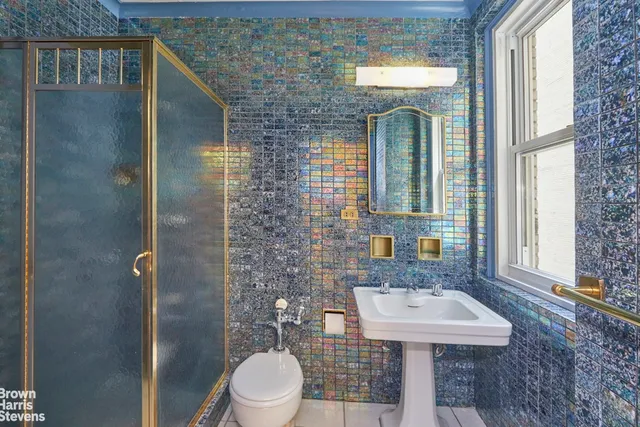 a view of an empty room with a fireplace