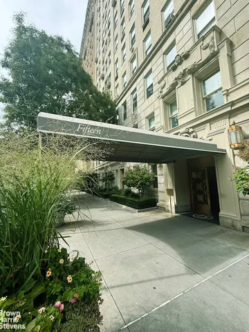 a bathroom with a sink a toilet a mirror and shower