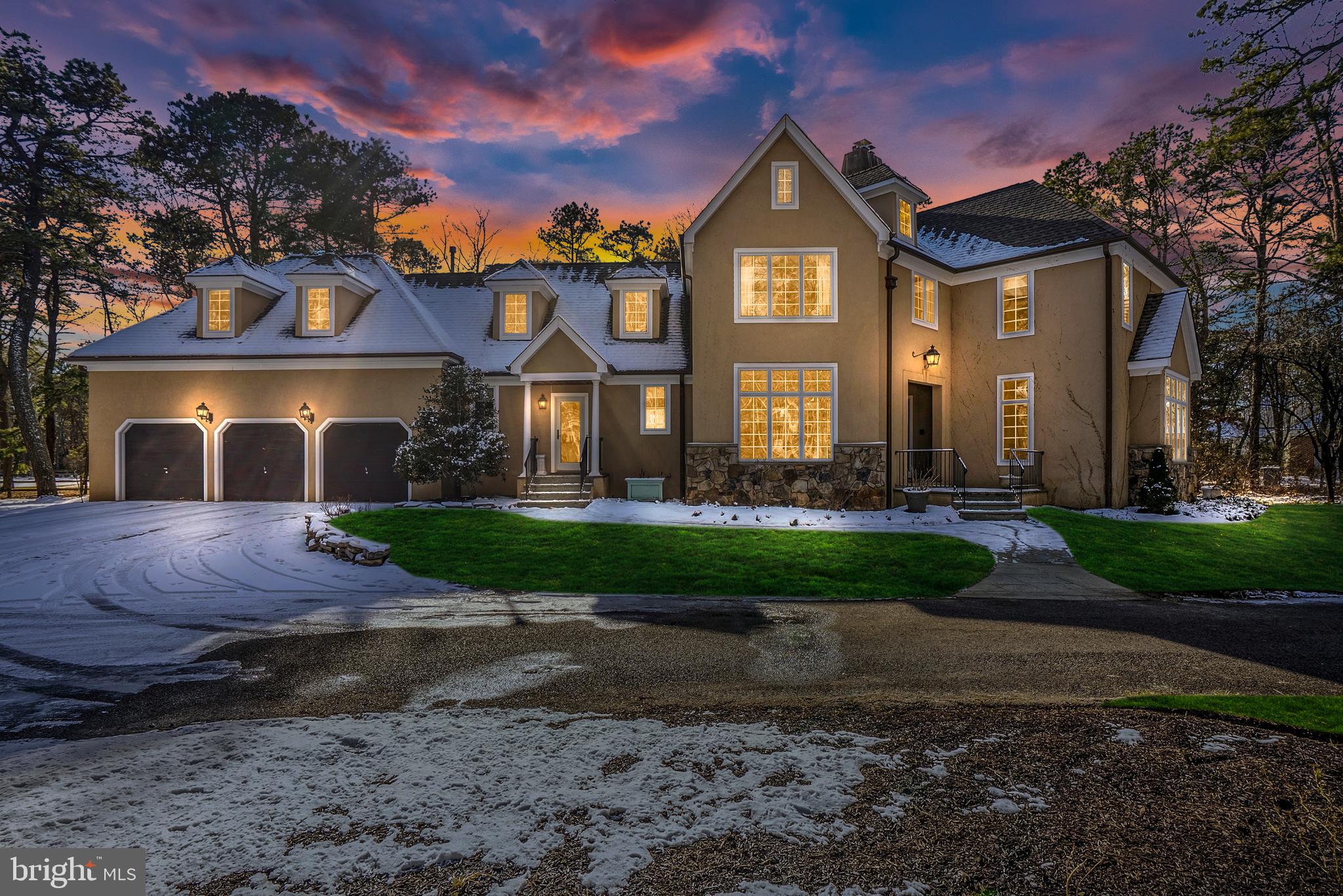 a front view of a house with a yard and outdoor space